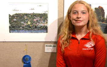 New Richmond High School sophomore Ellie Arkus is pictured from earlier this year with her winning entry in the Plein Air Art Show.