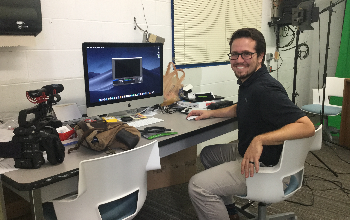 Integration specialist Dakota Smith with audio/visual equipment in New Richmond High School's makerspace.