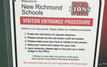 New signage explains visitor entrance procedures