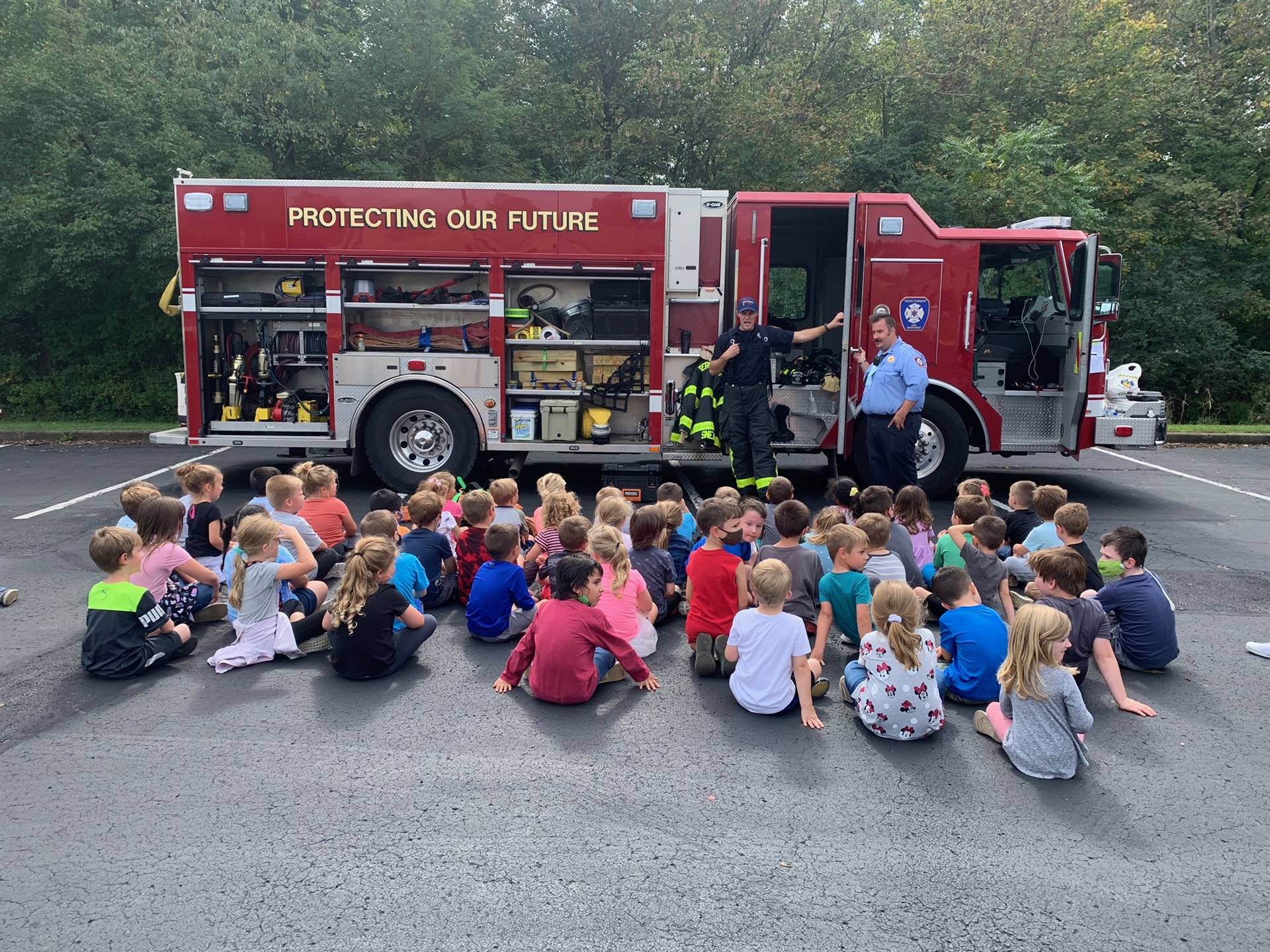 Pierce Township Fire/EMS visits LCE for safety day lessons. Pictured, students sitting in front of a