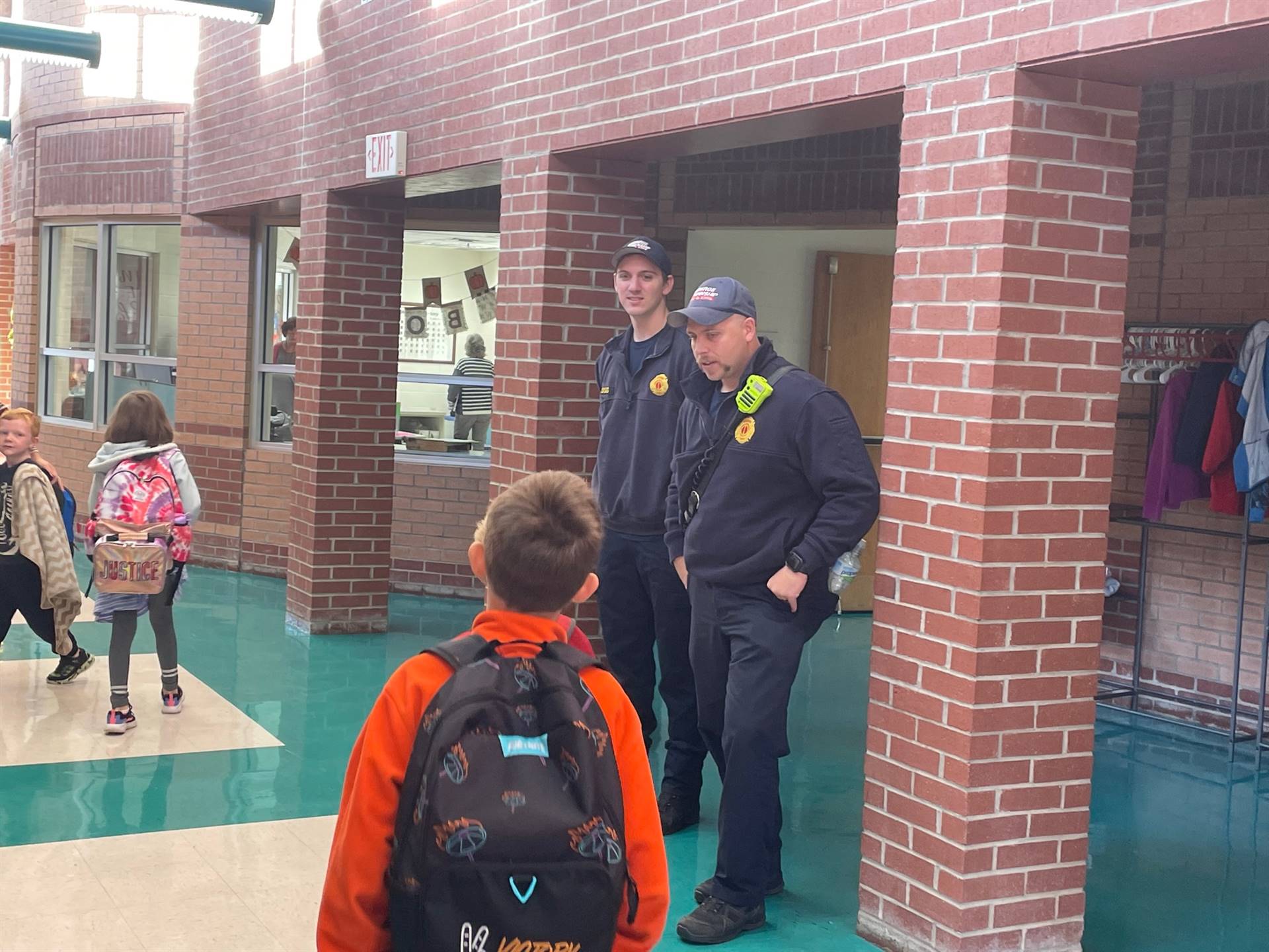 first hello week fire personnel greet students inside