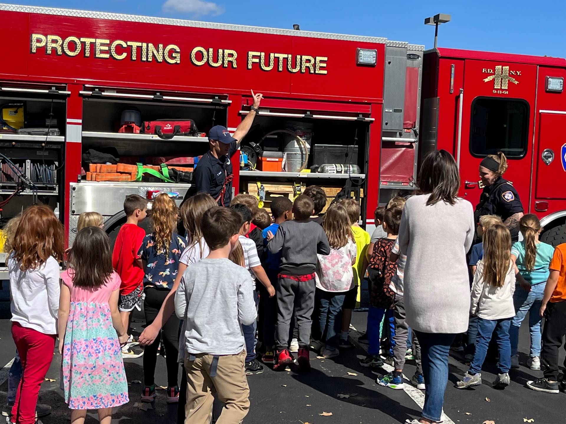 Students learning about fire truck